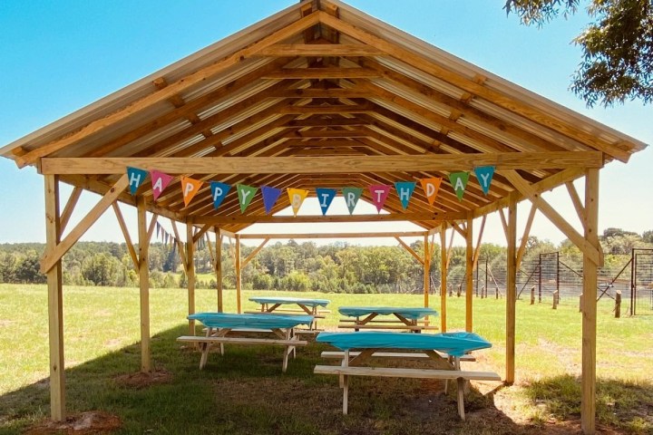 a couple of lawn chairs sitting on top of a wooden table