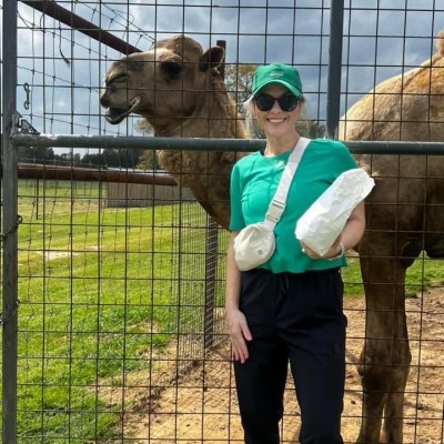a person standing in front of a fence