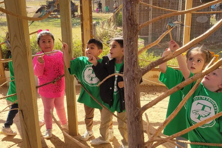 Maia Brewton et al. sitting at a playground